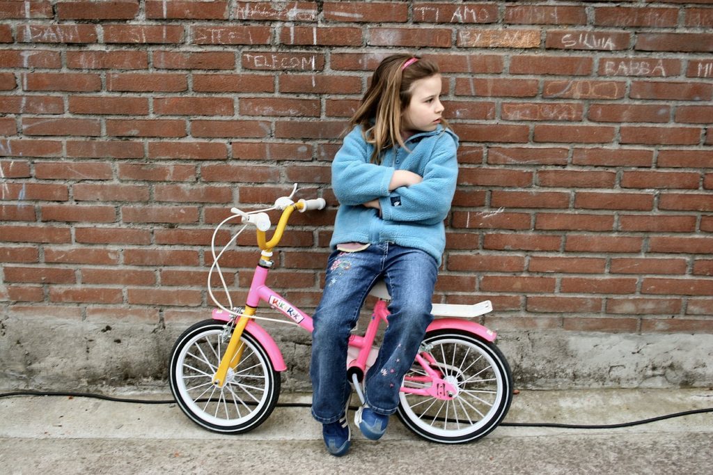 Little Girl Bicycle Boredom Child  - mfacchinetti / Pixabay