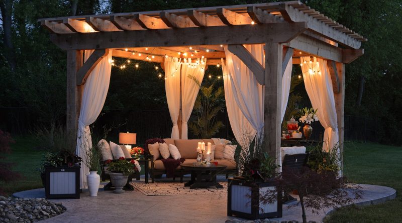 photo of gazebo with curtain and string lights