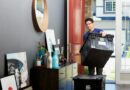 man in blue polo shirt sitting on chair